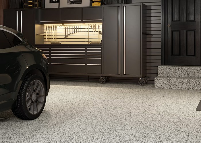 Living room with soft grey and cream furniture and carpet.